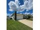 House exterior showcasing a two-car garage and driveway at 1837 Hickory Bluff Rd, Kissimmee, FL 34744
