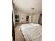 Spacious bedroom with carpeted floors and a view into another room at 1837 Hickory Bluff Rd, Kissimmee, FL 34744