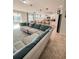 Spacious living area with a large sectional sofa and open view to kitchen at 1837 Hickory Bluff Rd, Kissimmee, FL 34744
