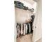 Shelved closet with hanging clothes at 1837 Hickory Bluff Rd, Kissimmee, FL 34744