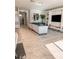 Open living room with tile floors, sectional sofa, and built-in shelving at 1837 Hickory Bluff Rd, Kissimmee, FL 34744