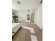 Bright bedroom with carpet flooring and a view of the dining room at 1837 Hickory Bluff Rd, Kissimmee, FL 34744