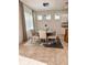 Formal dining room with large table and neutral color scheme at 1837 Hickory Bluff Rd, Kissimmee, FL 34744