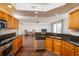 Modern kitchen with dark wood cabinets and granite countertops at 4177 N Orange Blossom Trl # 210, Orlando, FL 32804