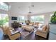 Spacious community room with comfortable seating and a piano at 4177 N Orange Blossom Trl # 210, Orlando, FL 32804