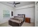 Bright bedroom with a double bed, nightstands, and ceiling fan at 4177 N Orange Blossom Trl # 210, Orlando, FL 32804