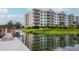 Lakefront condo building with multiple floors and balconies at 4177 N Orange Blossom Trl # 210, Orlando, FL 32804