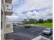 Balcony view of parking lot with lake access at 4177 N Orange Blossom Trl # 210, Orlando, FL 32804