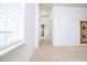Bright hallway with carpet, leading to bedrooms and bathroom at 4177 N Orange Blossom Trl # 210, Orlando, FL 32804