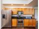 Stainless steel appliances and granite countertops in kitchen at 4177 N Orange Blossom Trl # 210, Orlando, FL 32804