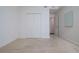Spacious bedroom with double doors leading to a closet and additional room at 4177 N Orange Blossom Trl # 210, Orlando, FL 32804