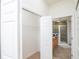 Spacious walk-in closet with built-in shelving and rod at 4177 N Orange Blossom Trl # 210, Orlando, FL 32804