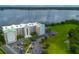 Aerial view of a condominium complex by the lake at 4177 N Orange Blossom Trl # 210, Orlando, FL 32804