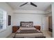 Bright bedroom with a double bed, nightstands, and ceiling fan at 4177 N Orange Blossom Trl # 210, Orlando, FL 32804