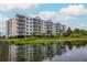 Lakeside community featuring a multi-story building with balconies at 4177 N Orange Blossom Trl # 210, Orlando, FL 32804