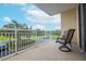 Relaxing balcony with patio furniture and a view of the parking lot at 4177 N Orange Blossom Trl # 210, Orlando, FL 32804