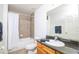 Clean bathroom with tub shower, granite vanity, and dark wood cabinets at 4177 N Orange Blossom Trl # 210, Orlando, FL 32804