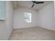 Empty bedroom with window and closet. Neutral colors at 4177 N Orange Blossom Trl # 210, Orlando, FL 32804