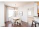 Bright dining room with hardwood floors and a chandelier at 4177 N Orange Blossom Trl # 210, Orlando, FL 32804