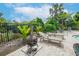 Relaxing pool area with lounge chairs and fire pit at 4177 N Orange Blossom Trl # 210, Orlando, FL 32804