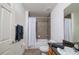 Clean bathroom with tub shower, granite vanity, and dark wood cabinets at 4177 N Orange Blossom Trl # 210, Orlando, FL 32804