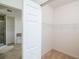 Walk-in closet with wire shelving and bathroom access at 4177 N Orange Blossom Trl # 210, Orlando, FL 32804
