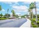Gated community entrance with lush landscaping and palm trees at 4177 N Orange Blossom Trl # 210, Orlando, FL 32804