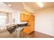 Kitchen boasts granite countertops and light wood cabinets at 4177 N Orange Blossom Trl # 210, Orlando, FL 32804
