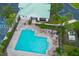 Community pool with lounge chairs, and a surrounding patio area at 4177 N Orange Blossom Trl # 210, Orlando, FL 32804