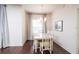 Dining room with chandelier, hardwood floors, and white table at 4177 N Orange Blossom Trl # 210, Orlando, FL 32804