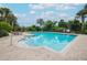 Community pool with lounge chairs and surrounding landscaping at 4177 N Orange Blossom Trl # 210, Orlando, FL 32804