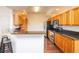 Kitchen features granite countertops and light wood cabinets at 4177 N Orange Blossom Trl # 210, Orlando, FL 32804