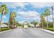 Gated entrance to community, palm trees and landscaping at 4177 N Orange Blossom Trl # 210, Orlando, FL 32804