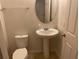 Clean bathroom with pedestal sink and toilet at 10710 Reams Rd, Windermere, FL 34786