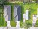 Aerial view of three houses and surrounding area at 623 Sylvan Ramble Rd, Davenport, FL 33837