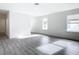 Bright and airy bedroom with hardwood floors and neutral walls at 623 Sylvan Ramble Rd, Davenport, FL 33837
