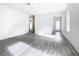 Open concept living room with hardwood floors and neutral colors at 623 Sylvan Ramble Rd, Davenport, FL 33837