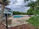 Community pool with surrounding patio and tropical landscaping at 2616 Lemon Tree Ln # F, Orlando, FL 32839