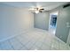 Simple bedroom with tile floor and ceiling fan at 2616 Lemon Tree Ln # F, Orlando, FL 32839