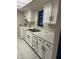Efficient kitchen with white cabinets and tiled floor at 2616 Lemon Tree Ln # F, Orlando, FL 32839