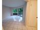 Bright Gathering room featuring tile floors and sliding glass doors to a private patio at 2616 Lemon Tree Ln # F, Orlando, FL 32839