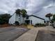 Exterior view of the building, showing the entrance and landscaping at 2616 Lemon Tree Ln # F, Orlando, FL 32839