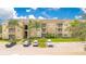 Apartment building with ample parking and landscaped grounds at 2300 Silver Palm Dr # 303, Kissimmee, FL 34747