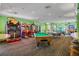Game room with arcade games, pool table, and ping pong at 2300 Silver Palm Dr # 303, Kissimmee, FL 34747
