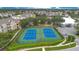 Two well-maintained tennis courts at 2300 Silver Palm Dr # 303, Kissimmee, FL 34747