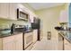 Well-equipped kitchen with granite countertops and stainless steel appliances at 2300 Silver Palm Dr # 303, Kissimmee, FL 34747