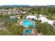 Community pool with surrounding lounge chairs and landscaping at 2300 Silver Palm Dr # 303, Kissimmee, FL 34747