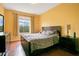 Main bedroom with king-size bed, large window with nature view, and dresser at 2300 Silver Palm Dr # 303, Kissimmee, FL 34747