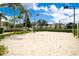 Outdoor sand volleyball court with surrounding landscaping at 2300 Silver Palm Dr # 303, Kissimmee, FL 34747
