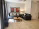 Living room with gray sectional sofa and wood coffee table at 5706 Olga St, Kissimmee, FL 34746